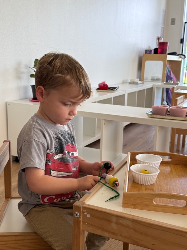Kindergartener working on math at Shadowridge Montessori School in Vista, CA.