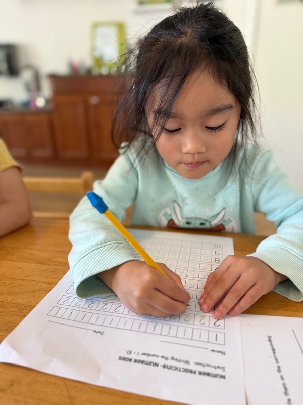 Primary child learning how to solve math problems at Shadowridge Montessori School in Vista